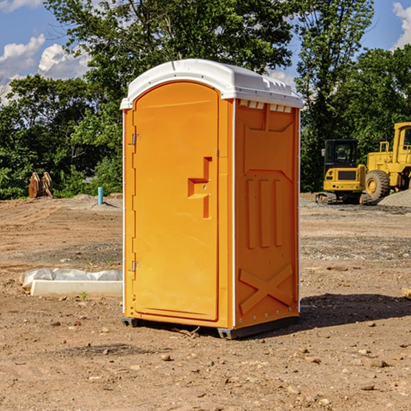 what is the cost difference between standard and deluxe portable restroom rentals in Owensville